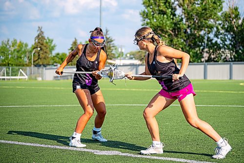 NIC ADAM / FREE PRESS
The Manitoba women's U19 field lacrosse team&#x2019;s Payton Cvetkovic (5, left) and Elle Garriock (8) practicing at Ralph Cantafio Soccer Complex Wednesday before the national women's U19 field lacrosse championship at Ralph Cantafio this weekend.
240731 - Wednesday, July 31, 2024.

Reporter: Josh