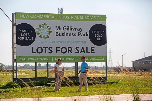 BROOK JONES / FREE PRESS
Stephen Kleysen (right), 27, who is the vice-president of T2K Enterprises Ltd., and Shannon Kleysen, 27, who is the director of administration of T2K Enterprises are pictured in front of their McGillivrary Business Park lots for sale sign in Oak Bluff, Man., Thursday, Aug. 1, 2024. The brother-sister duo, who are twins, are the children of T2K President Tom Kleysen. The McGillivray Business Park is continuing to expand as at least 20 businesses have been built or agreed to build on the 160 acres during the past two and a half years.