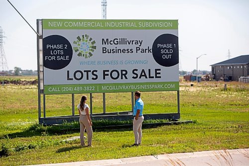 BROOK JONES / FREE PRESS
Stephen Kleysen (right), 27, who is the vice-president of T2K Enterprises Ltd., and Shannon Kleysen, 27, who is the director of administration of T2K Enterprises are pictured looking at their McGillivrary Business Park lots for sale sign in Oak Bluff, Man., Thursday, Aug. 1, 2024. The brother-sister duo, who are twins, are the children of T2K President Tom Kleysen. The McGillivray Business Park is continuing to expand as at least 20 businesses have been built or agreed to build on the 160 acres during the past two and a half years.