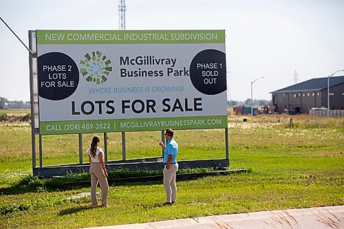 BROOK JONES / FREE PRESS
Stephen Kleysen (right), 27, who is the vice-president of T2K Enterprises Ltd., and Shannon Kleysen, 27, who is the director of administration of T2K Enterprises are pictured looking at their McGillivrary Business Park lots for sale sign in Oak Bluff, Man., Thursday, Aug. 1, 2024. The brother-sister duo, who are twins, are the children of T2K President Tom Kleysen. The McGillivray Business Park is continuing to expand as at least 20 businesses have been built or agreed to build on the 160 acres during the past two and a half years.