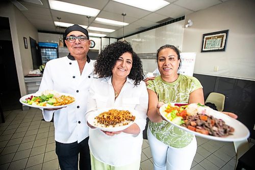 MIKAELA MACKENZIE / FREE PRESS

	
Chef George Abraham (left) and pavilion co-ordinators Hala Salama (centre) and Omneya Khalifa with Egyptian dishes at House of Taste on Wednesday, July 31, 2024. 

For Eva story.