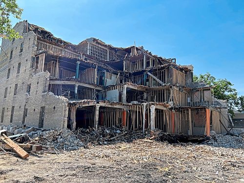 TYLER SEARLE / FREE PRESS

Demolition at 579 McDermot Ave. has ground to a halt after city inspectors identifed the possible presence of asbestos. August 01, 2024

