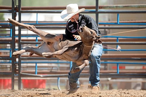 01082024
Colt Van Straten of Stettler, Alberta throws down a lassoed calf to tie the legs during the high school tie down roping event at the first go-round of the 2024 Canadian High School Rodeo Finals at the Keystone Centre on a scorching hot Thursday. Approximately 250 contestants from across the country are competing in the finals, which wrap up Saturday.
(Tim Smith/The Brandon Sun)