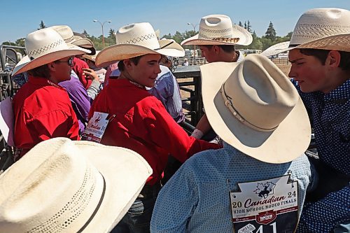 01082024
Young cowboys socialize behind the chutes at the first go-round of the 2024 Canadian High School Rodeo Finals at the Keystone Centre on Thursday. Approximately 250 contestants from across the country are competing in the finals, which wrap up Saturday.
(Tim Smith/The Brandon Sun)