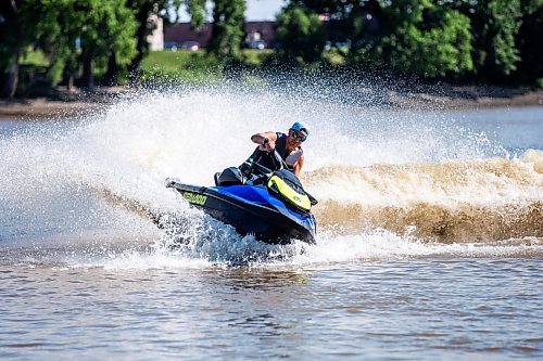 MIKAELA MACKENZIE / FREE PRESS

	
T. J. Gardiner cools down by splashing down the Red River on a Sea-Doo (from St. Vital Park to The Forks and back) on Thursday, Aug. 1, 2024. 

For heat story.