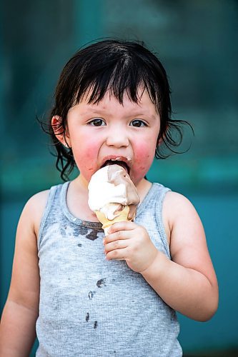 MIKAELA MACKENZIE / FREE PRESS

	
Two-year-old Secora Raven eats an ice cream after cooling down at the splash pad at The Forks on Thursday, Aug. 1, 2024. 

For heat story.