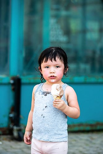 MIKAELA MACKENZIE / FREE PRESS

	
Two-year-old Secora Raven eats an ice cream after cooling down at the splash pad at The Forks on Thursday, Aug. 1, 2024. 

For heat story.