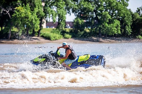 MIKAELA MACKENZIE / FREE PRESS

	
T. J. Gardiner cools down by splashing down the Red River on a Sea-Doo (from St. Vital Park to The Forks and back) on Thursday, Aug. 1, 2024. 

For heat story.