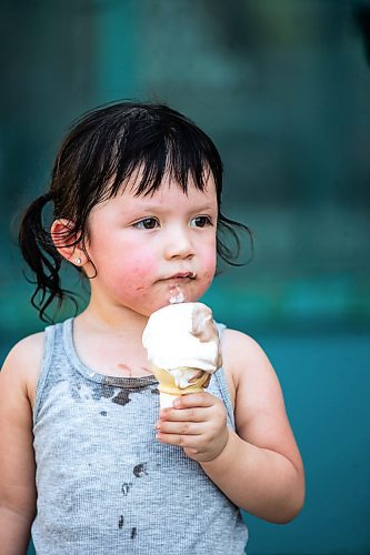 MIKAELA MACKENZIE / FREE PRESS

	
Two-year-old Secora Raven eats an ice cream after cooling down at the splash pad at The Forks on Thursday, Aug. 1, 2024. 

For heat story.