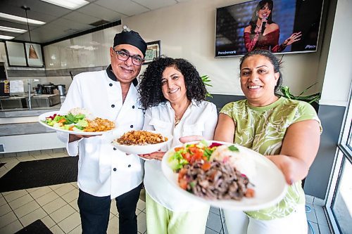 MIKAELA MACKENZIE / FREE PRESS

	
Chef George Abraham (left) and pavilion co-ordinators Hala Salama (centre) and Omneya Khalifa with Egyptian dishes at House of Taste on Wednesday, July 31, 2024. 

For Eva story.