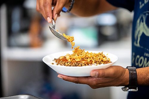 MIKAELA MACKENZIE / FREE PRESS

	
House of Taste owner Mamdouh Hanna dishes up koshary, which will be one of the dishes at this year&#x573; pavilion, on Wednesday, July 31, 2024. 

For Eva story.