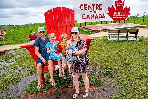 NIC ADAM / FREE PRESS
Ryan, Harper, Griffin, Vienna, and Tiffany Swallow (from left) from Saskatchewan pictured at the longitudinal centre of Canada, just off hwy 1 Tuesday.
240723 - Tuesday, July 23, 2024.

Reporter: Jura