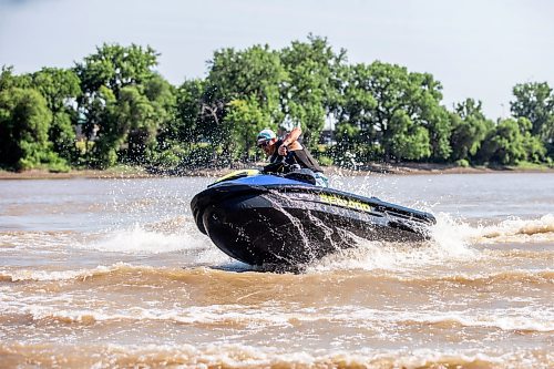 MIKAELA MACKENZIE / FREE PRESS

	
T. J. Gardiner cools down by splashing down the Red River on a Sea-Doo (from St. Vital Park to The Forks and back) on Thursday, Aug. 1, 2024. 

For heat story.