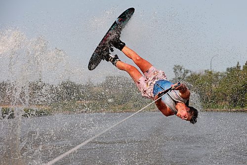 Professional waterskier Bradley Gibbons of Calgary flips through the air while trick skiing with the Brandon Waterski Club on the Assiniboine River on Friday. Gibbons has been in Manitoba leading coaching clinics for the past few weeks including a two-day clinic with the Brandon Waterski Club. (Tim Smith/The Brandon Sun)