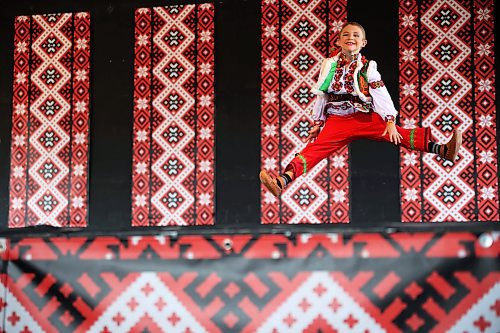 Eight-year-old Rider Gray with Yednist School of Ukrainian Dance performs in the Hutzul solo male seven to nine years old category in the talent competition during the opening day of Canada's National Ukrainian Festival at Selo Ukraina south of Dauphin on Friday. The three-day event includes all manner of entertainment and celebration of Ukrainian culture. See more photos on Page A4. (Tim Smith/The Brandon Sun)