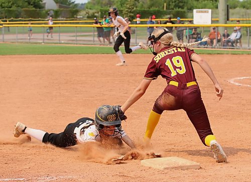 Westman Magic base runner Brielle McGonigal is tagged out by Southeast Sun Devils third baseman Kelci Sorestad (19) during the under-13 western Canadian championship at the Ashley Neufeld Softball Complex on Friday afternoon. 
(Perry Bergson/The Brandon Sun)
Aug. 2, 2024