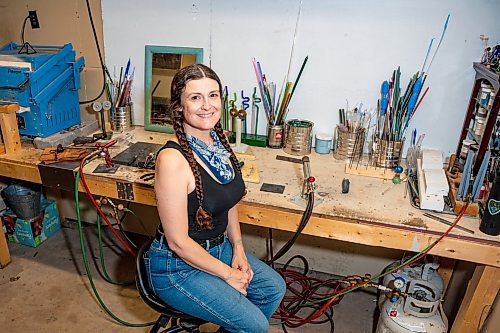 NIC ADAM / FREE PRESS
Glass worker Brook Drabot pictured in the garage studio of her Warren home Friday. Brook loves making very small things, blowing glass to create tiny vases, miniature ornaments and small bowls. 
240801 - Thursday, August 01, 2024.

Reporter: