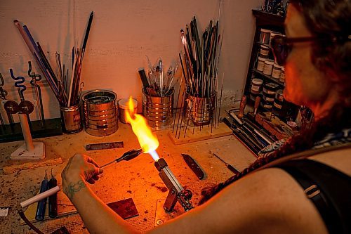 NIC ADAM / FREE PRESS
Glass worker Brook Drabot pictured blowing glass in the garage studio of her Warren home Friday. Brook loves making very small things, blowing glass to create tiny vases, miniature ornaments and small bowls. 
240801 - Thursday, August 01, 2024.

Reporter: