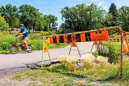 NIC ADAM / FREE PRESS
Residents say the huge hole we reported on last year, pictured Friday, remains alongside the Sturgeon Creek pathway. Coun. Shawn Dobson said he agrees as it poses a safety hazard, though the city has a plan to fix it. 
240802 - Friday, August 02, 2024.

Reporter: Joyanne
