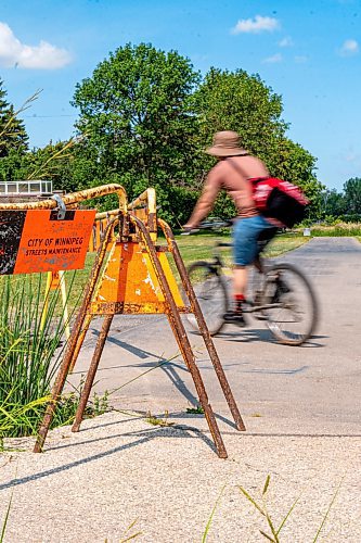 NIC ADAM / FREE PRESS
Residents say the huge hole we reported on last year, pictured Friday, remains alongside the Sturgeon Creek pathway. Coun. Shawn Dobson said he agrees as it poses a safety hazard, though the city has a plan to fix it. 
240802 - Friday, August 02, 2024.

Reporter: Joyanne
