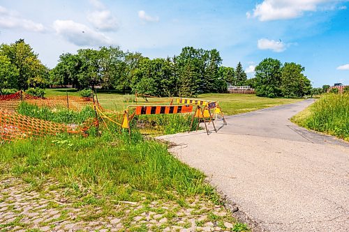 NIC ADAM / FREE PRESS
Residents say the huge hole we reported on last year, pictured Friday, remains alongside the Sturgeon Creek pathway. Coun. Shawn Dobson said he agrees as it poses a safety hazard, though the city has a plan to fix it. 
240802 - Friday, August 02, 2024.

Reporter: Joyanne
