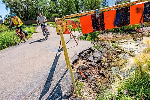 NIC ADAM / FREE PRESS
Residents say the huge hole we reported on last year, pictured Friday, remains alongside the Sturgeon Creek pathway. Coun. Shawn Dobson said he agrees as it poses a safety hazard, though the city has a plan to fix it. 
240802 - Friday, August 02, 2024.

Reporter: Joyanne
