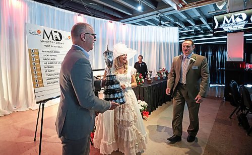 Ruth Bonneville / Free Press

Sports - MB Derby

Winnipeg Mayor Scott Gillingham has his photo taken with the Queens Trophy after a live draw took place at luncheon at the Assiniboine Downs and the names of the horses were posted by ASD Derby Belle, Francine Fournier for this years Manitoba Derby on Friday.  Assiniboine Downs CEO,  Darren Dunn, also in the photo. 

The 76th running of the Manitoba Derby presented by Manitoba Liquor &amp; Lotteries takes place on Monday, August 5 at 7:30 p.m.


Aug 2nd,  2024

