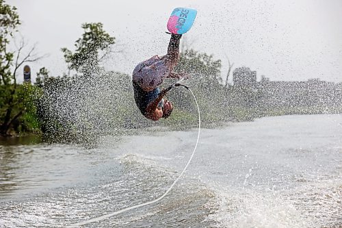 02082024
Professional waterskier Bradley Gibbons of Calgary flips through the air while trick skiing with the Brandon Waterski Club on the Assiniboine River on Friday afternoon. Gibbons has been in Manitoba leading coaching clinics for the past few weeks including a two-day clinic with the Brandon Waterski Club.
(Tim Smith/The Brandon Sun)