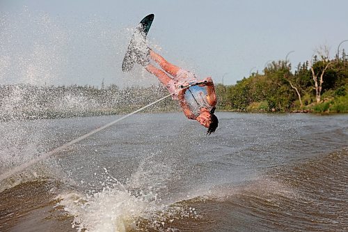 02082024
Professional waterskier Bradley Gibbons of Calgary flips through the air while trick skiing with the Brandon Waterski Club on the Assiniboine River on Friday afternoon. Gibbons has been in Manitoba leading coaching clinics for the past few weeks including a two-day clinic with the Brandon Waterski Club.
(Tim Smith/The Brandon Sun)