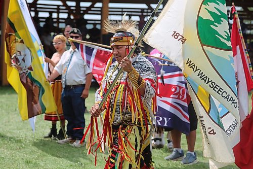 A flag-bearer for the Waywayseecappo Treaty 4 flag, participates in the Grand Entry of the powwow on Saturday. (Geena Mortfield/The Brandon Sun)