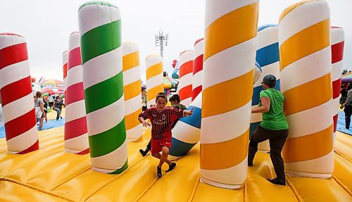 JOHN WOODS / FREE PRESS
People bounce on inflatable attractions at Big Bounce Canada, home of the largest bounce house, at Red River Exhibition Park Sunday, August 4, 2024. 

Reporter: ?