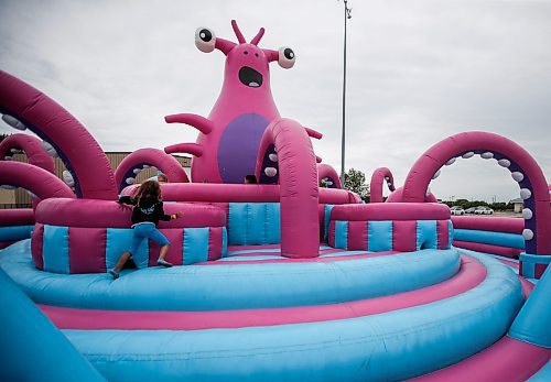 JOHN WOODS / FREE PRESS
People bounce on inflatable attractions at Big Bounce Canada, home of the largest bounce house, at Red River Exhibition Park Sunday, August 4, 2024. 

Reporter: ?