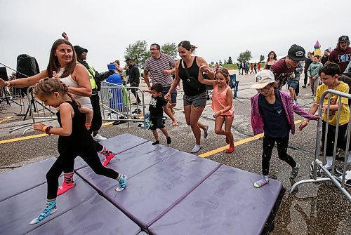 JOHN WOODS / FREE PRESS
People bounce on inflatable attractions at Big Bounce Canada, home of the largest bounce house, at Red River Exhibition Park Sunday, August 4, 2024. 

Reporter: ?