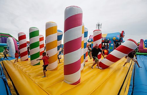 JOHN WOODS / FREE PRESS
People bounce on inflatable attractions at Big Bounce Canada, home of the largest bounce house, at Red River Exhibition Park Sunday, August 4, 2024. 

Reporter: ?