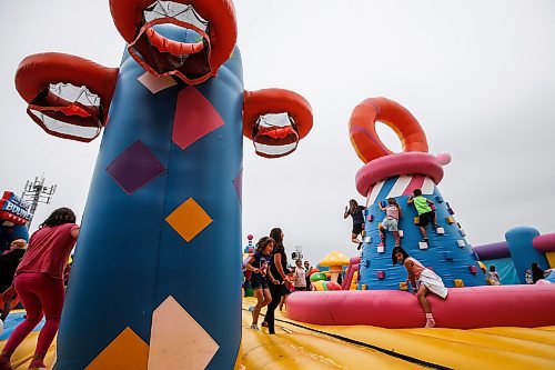 JOHN WOODS / FREE PRESS
People bounce on inflatable attractions at Big Bounce Canada, home of the largest bounce house, at Red River Exhibition Park Sunday, August 4, 2024. 

Reporter: ?