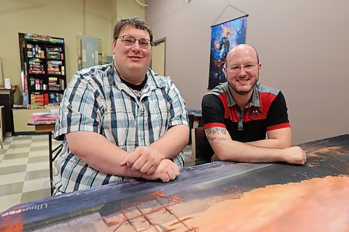 I Want That Stuff owner Corey Trembley (left) and marketing coordinator Scott Morris sit in the new downtown store at 138 10th St. on Monday. (Abiola Odutola/The Brandon Sun)