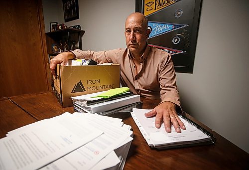 JOHN WOODS / FREE PRESS
Dave Brown, a former coach who took Manitoba Hockey, looks through court documents at his home Monday, August 5, 2024. Brown has abandoned his lawsuit due to the expense and challenge of the case and accepted a out-of-court settlement.

Reporter: tyler