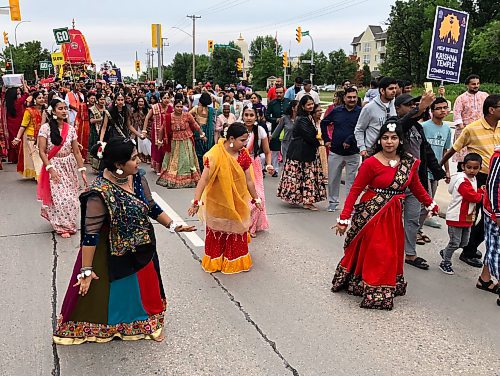 Dancers Payal Pardasani (from left), Angel Sharma and Ikankshi Prabhakar lead the Festival of Chariots procession. (John Longhurst / Free Press)
