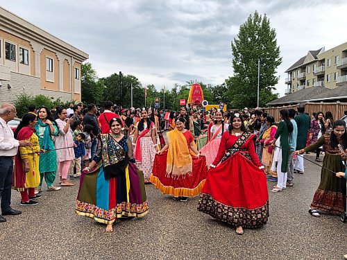 Dancers Payal Pardasani (from left), Angel Sharma and Ikankshi Prabhakar prepare to lead the Festival of Chariots procession. (John Longhurst / Free Press)
