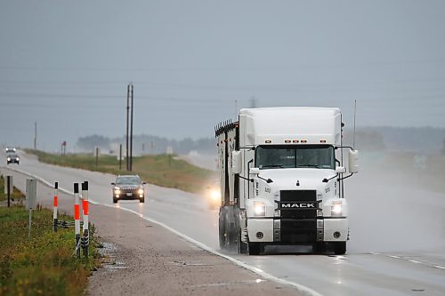 Illustration (licence plate removed)
A semi-trailer truck travels west on Highway 1 near Brandon on a rainy afternoon.    (Tim Smith/The Brandon Sun)