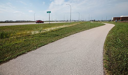 JOHN WOODS / FREE PRESS
Northbound traffic just south of the Waverley and Kenaston Blvd. intersection photographed from the bike path that runs beside the major route Monday, August 6, 2024. A male was taken to hospital after rear ending a vehicle on Friday, and died later that day.

Reporter: chris