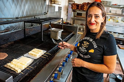 NIC ADAM / FREE PRESS
Brazilian cheese maker Fabiola Della Pria pictured cooking her BBGrill cheese in Hermano&#x2019;s restaurant in the Exchange District Tuesday. Last month Fabiola's Minas frescal cheese won 2nd place in an international competition in Buffalo, NY. that Hermano's is creating a salad and burger with.
240806 - Tuesday, August 06, 2024.

Reporter: Dave