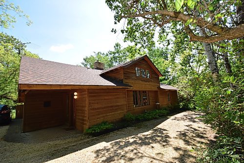 Photos by Todd Lewys / Free Press
Surrounded by mature trees, this home is a rustic masterpiece.