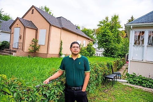 NIC ADAM / FREE PRESS
Ed Artola, pictured outside his property Wednesday, is a Winnipeg landlord who blames a vacant house next door for preventing him from being able to sell a home he owns and rents out on Atlantic Avenue. After putting his property on the market for over a year, Artola said his realtor told him the vacant home, which attracts squatters and poses a fire risk, was the issue deterring buyers. 
240807 - Wednesday, August 07, 2024.

Reporter: Joyanne