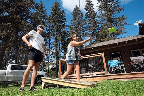 06082024
Conner Brady and his grandmother Alane Seeman play cornhole with family in Wasagaming on a warm Wednesday afternoon.     (Tim Smith/The Brandon Sun) 