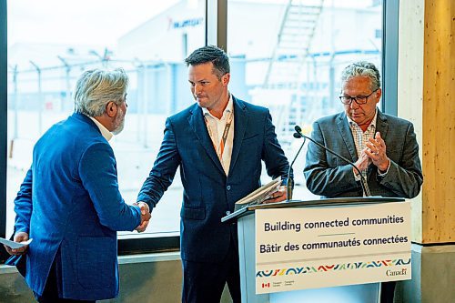 NIC ADAM / FREE PRESS
Perimeter Aviation President and CEO Joey Petrisor shakes hands with Minister of Transport and Quebec Lieutenant Pablo Rodriguez at an announcement on infrastructure funding to enhance regional connectivity in the Prairies in the newly renovated Perimeter terminal Thursday.
240808 - Thursday, August 08, 2024.

Reporter: Martin