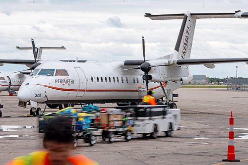 NIC ADAM / FREE PRESS
Perimeter Aviation workers prepare planes before takeoff at the newly renovated Perimeter terminal Thursday.
240808 - Thursday, August 08, 2024.

Reporter: Martin