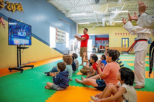 NIC ADAM / FREE PRESS
TRP Academy head instructor Steven Rivest and the gym&#x2019;s ages 5-9 summer camp watch Winnipegger Skylar Park receive her bronze medal at the 2024 Paris Olympics.
240808 - Thursday, August 08, 2024.

Reporter: ?