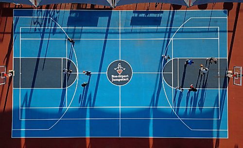 Basketball players cast long shadows as they shoot hoops at the Jumpstart Multi Sport Court in Brandon’s south end on Friday evening. (Tim Smith/The Brandon Sun)default