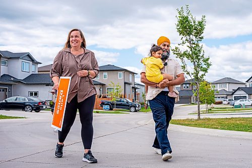 NIC ADAM / FREE PRESS
NDP candidate Leila Dance (right), NDP Leader Jagmeet Singh, and his youngest daughter set up campaign signs in Peguis Friday for the upcoming Elmwood-Transcona byelection.
240809 - Friday, August 09, 2024.

Reporter: Aaron